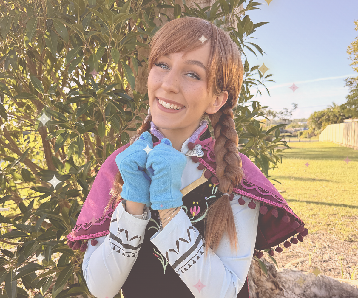 Snow Princess character performer in a winter cape with braided hair
