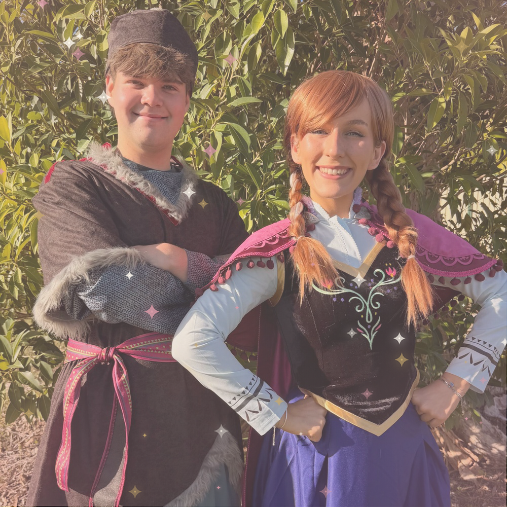 Anna and Kristoff character performers greeting children at a birthday celebration