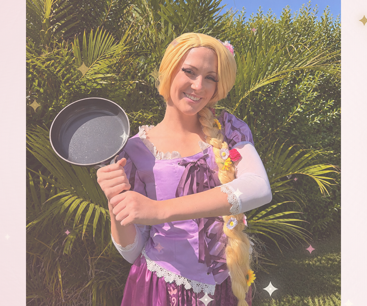 Long-Haired Princess character performer in a purple gown with a long golden braid